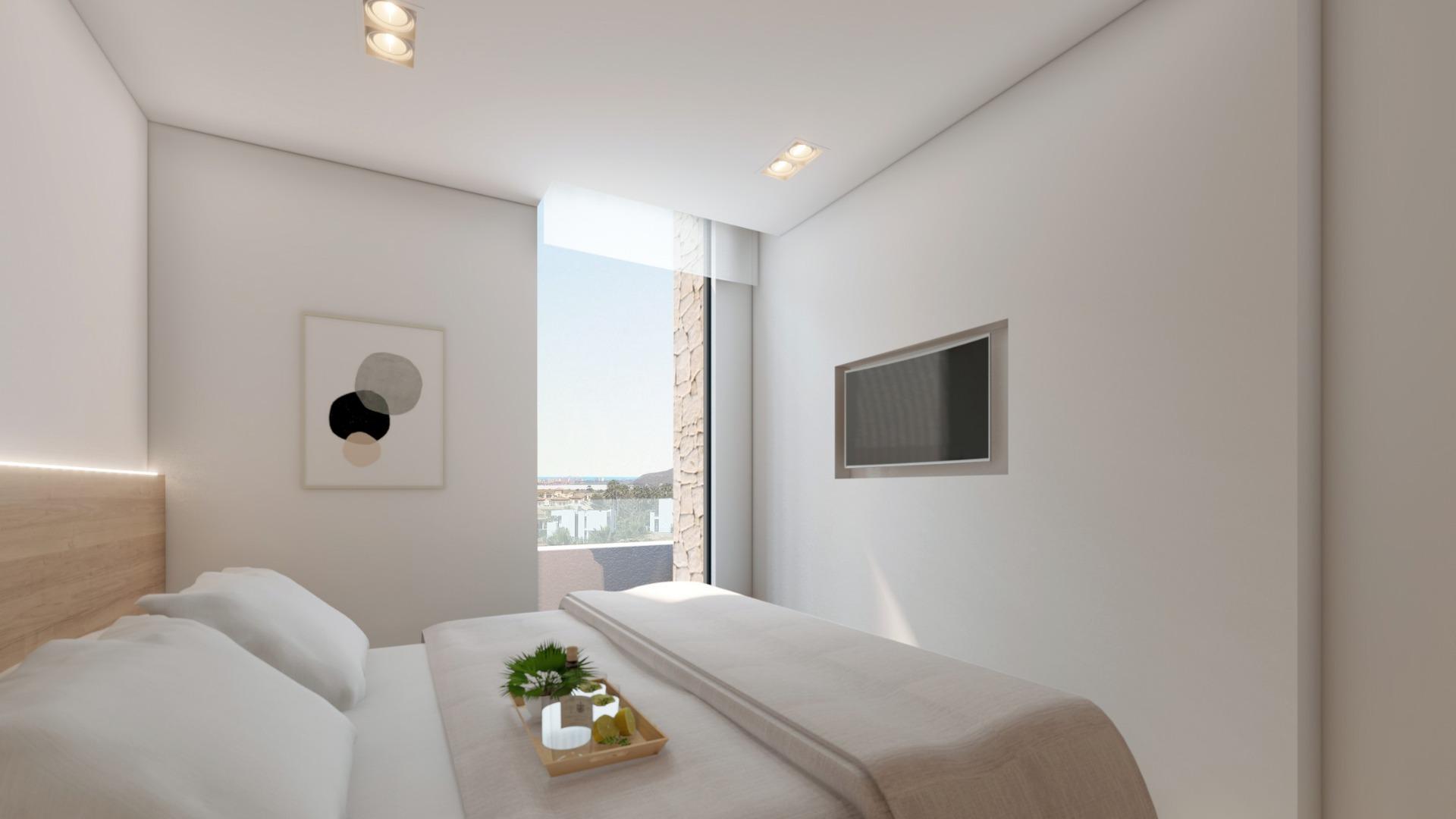 NEW-BUILD-RESIDENTIAL-COMPLEX-IN-LA-MANGA-CLUB-RESORT-11 Double bedroom with views towards the Mar Menor