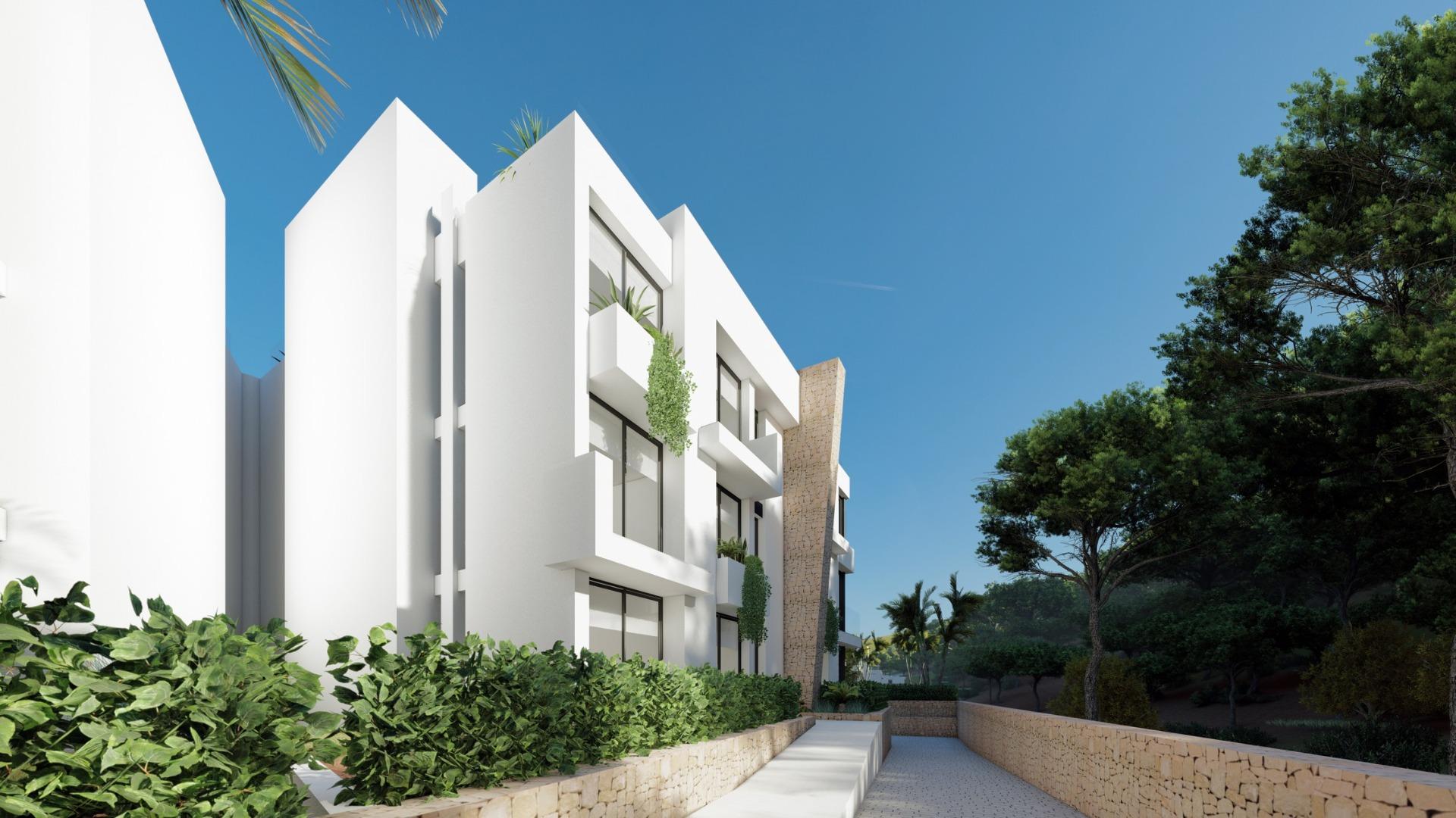NEW-BUILD-RESIDENTIAL-COMPLEX-IN-LA-MANGA-CLUB-RESORT-12 Landscaped entrance path beside the Las Orquídeas apartment building