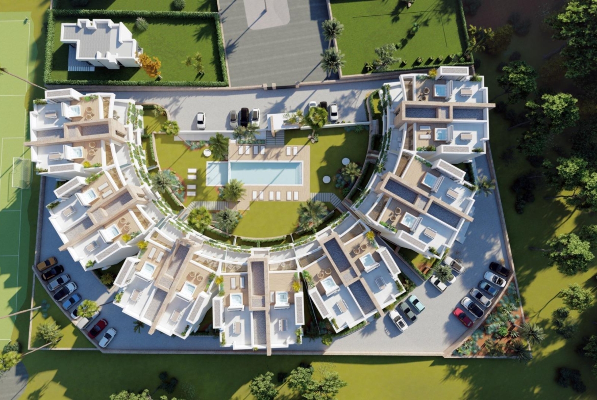 NEW-BUILD-RESIDENTIAL-COMPLEX-IN-LA-MANGA-CLUB-RESORT-14 Aerial site layout with communal pool, gardens and apartment buildings