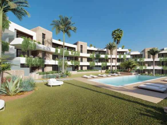 Communal pool and landscaped gardens beside contemporary apartments in La Manga Club