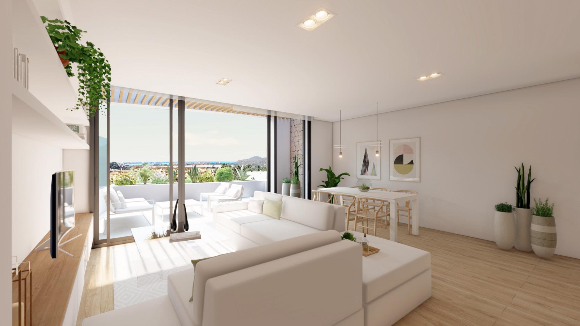 NEW-BUILD-RESIDENTIAL-COMPLEX-IN-LA-MANGA-CLUB-RESORT-5 Bright living room with terrace and views across La Manga Club to the Mar Menor