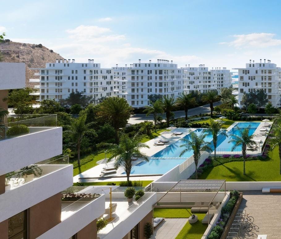 Apartment balconies overlooking landscaped grounds and pools in Playa del Torres, Villajoyosa, Alicante