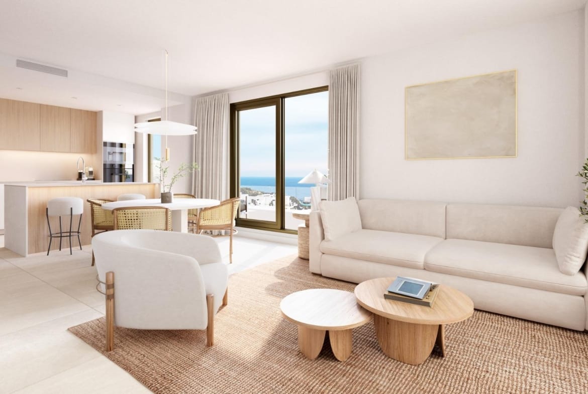 Open plan living and dining room beside a kitchen and terrace doors in Playa del Torres, Villajoyosa, Alicante