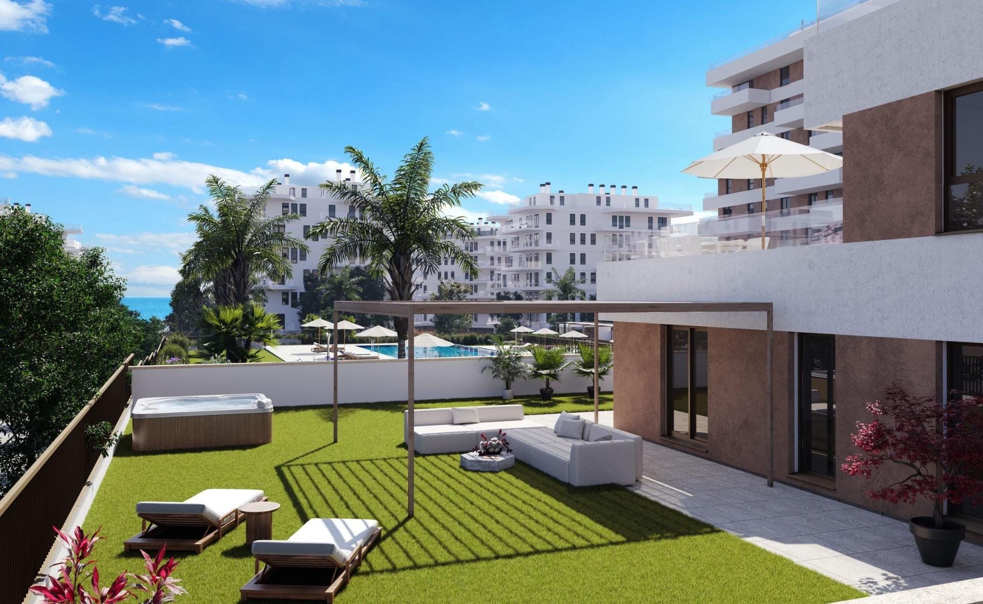 Ground floor garden with pergola seating, sun loungers and a hot tub in Playa del Torres, Villajoyosa, Alicante