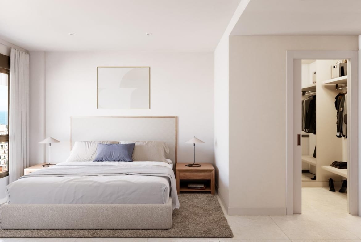 Double bedroom with a large window and dressing area in Playa del Torres, Villajoyosa, Alicante