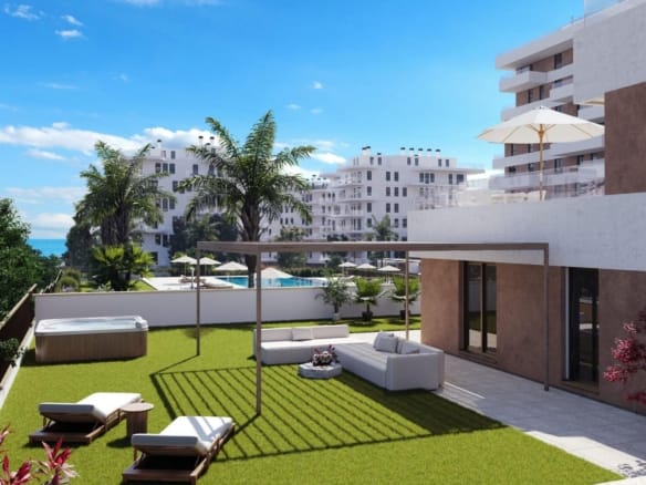 Ground-floor apartment terrace and garden with lounge area, hot tub and pool views