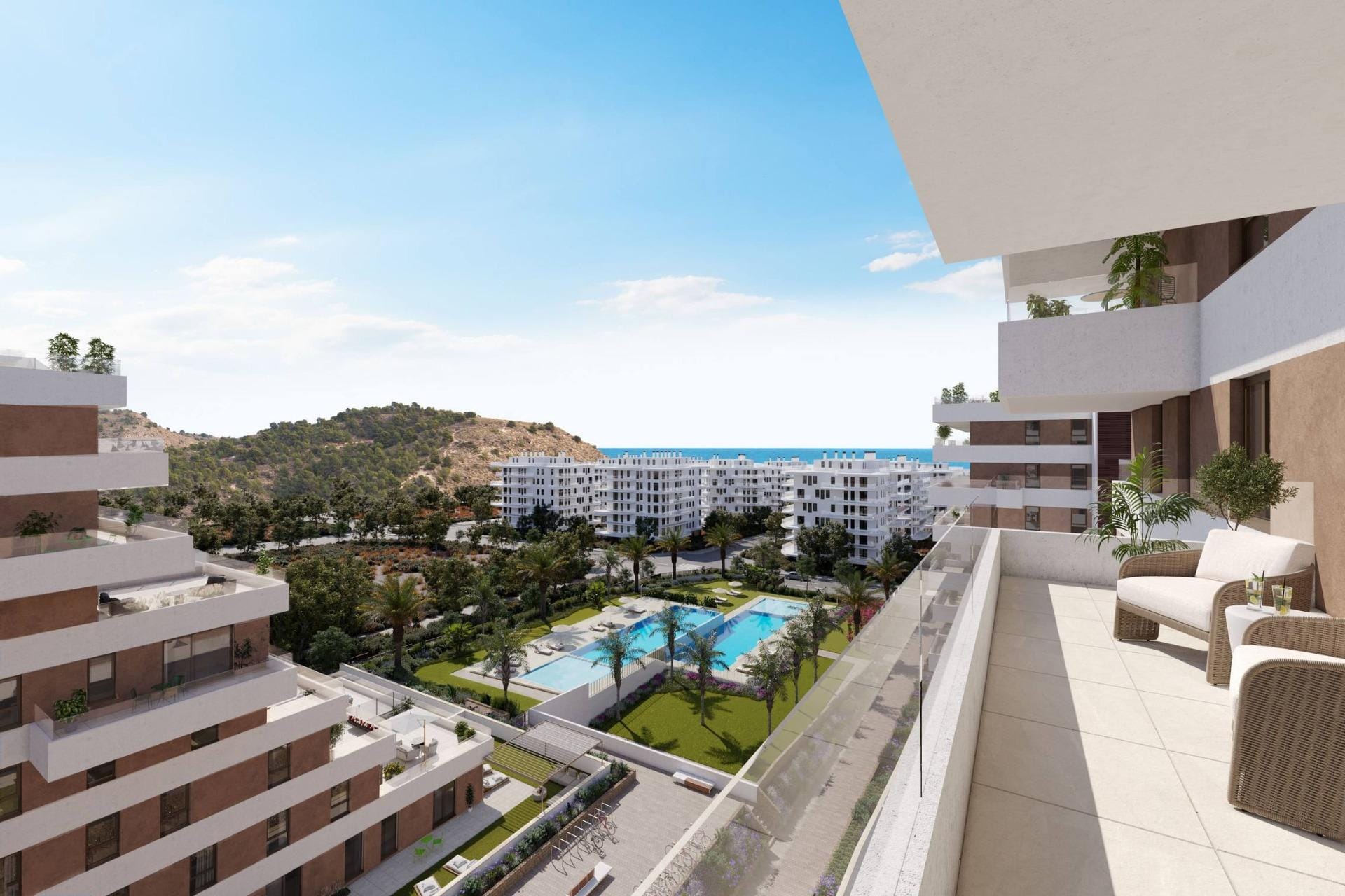 Balcony seating above communal pools and gardens in Playa del Torres, Villajoyosa, Alicante