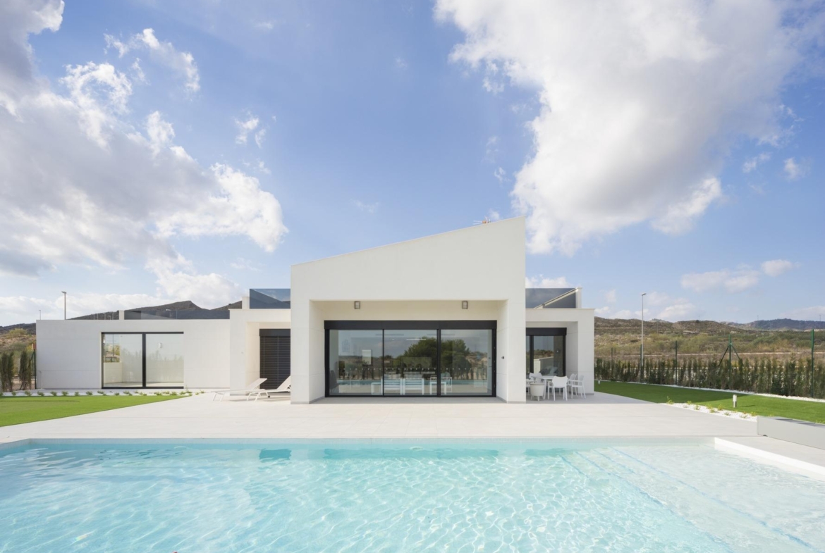 Front-facing render of single-storey villa with large terrace and pool in the foreground