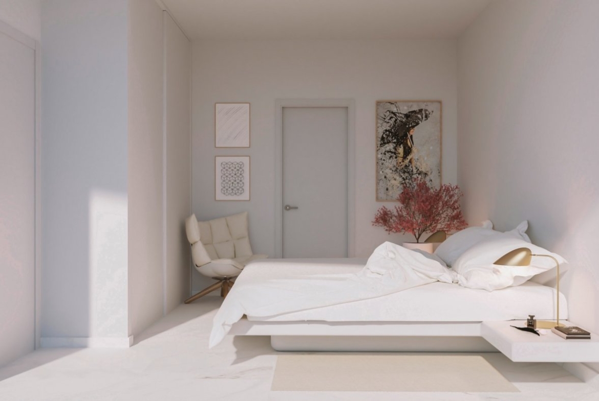 Minimal bedroom with low platform bed, accent chair and framed abstract wall art