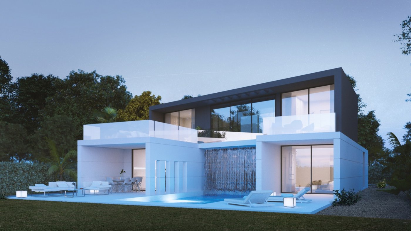 Two-storey villa exterior with glass balustrade terraces and illuminated pool at dusk