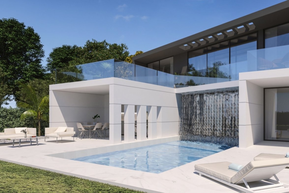 Poolside close-up showing waterfall feature, shaded dining area and two sun loungers on terrace