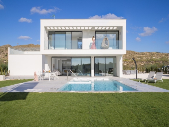 Two-storey white villa facade with ground-floor pool, terrace and upper balcony