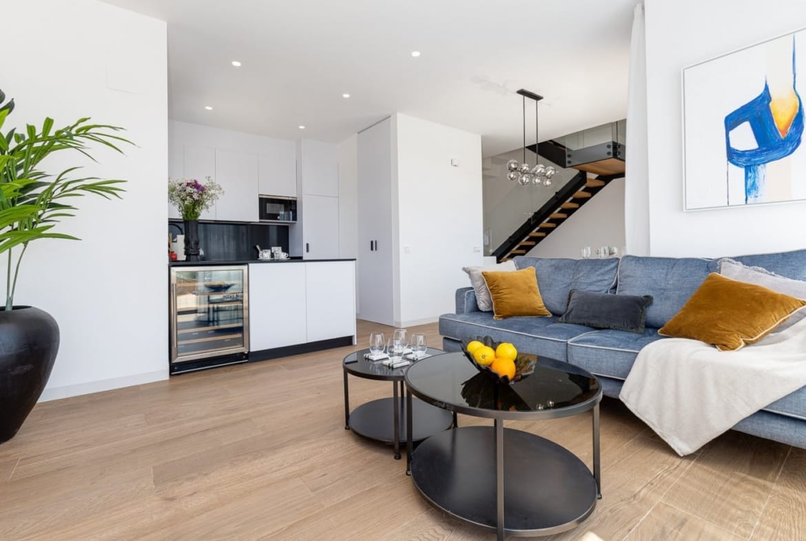 Living room with sofa beside the staircase in Balcón de Finestrat, Alicante