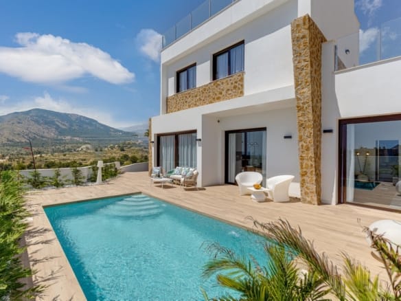Villa exterior with private pool and mountain backdrop in Balcón de Finestrat, Alicante