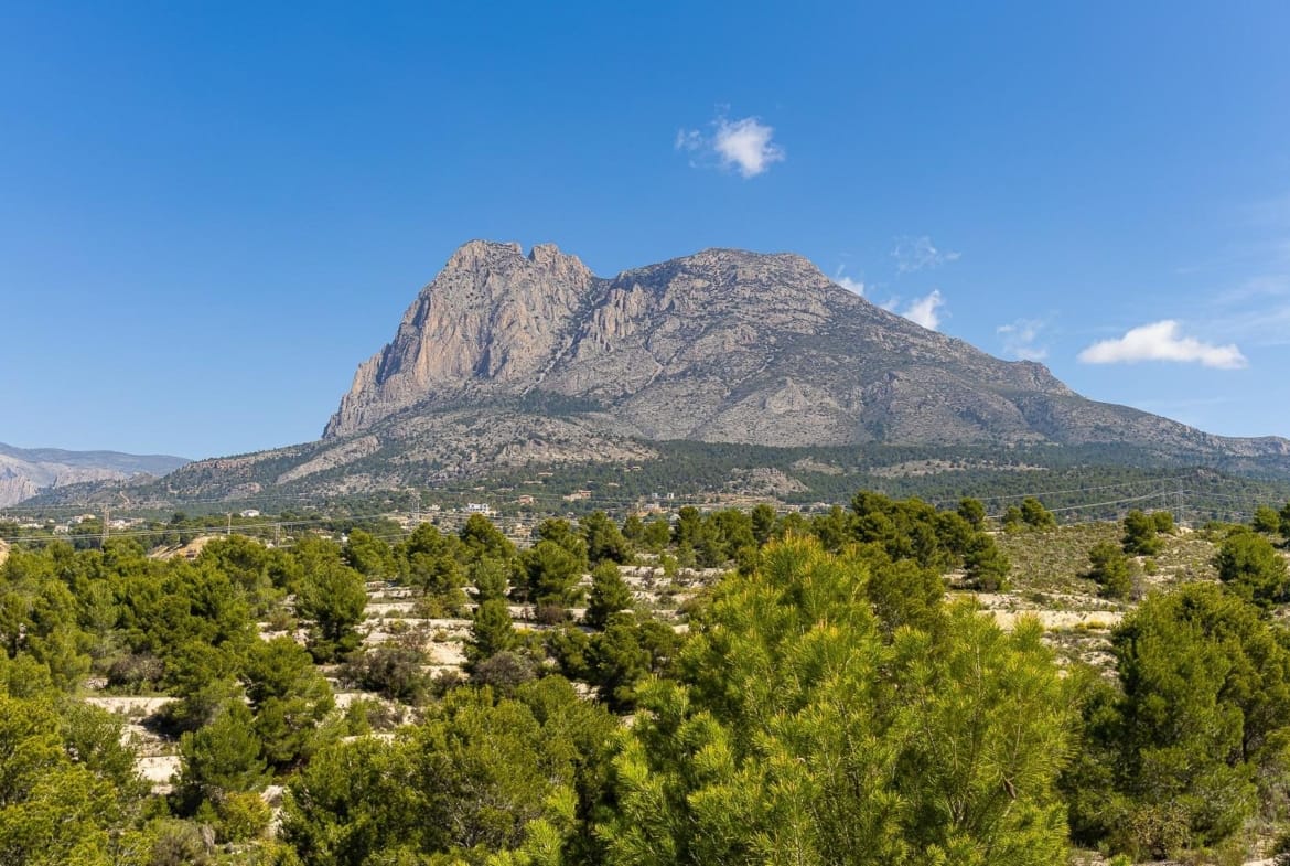 Puig Campana mountain above surrounding greenery in Balcón de Finestrat, Alicante