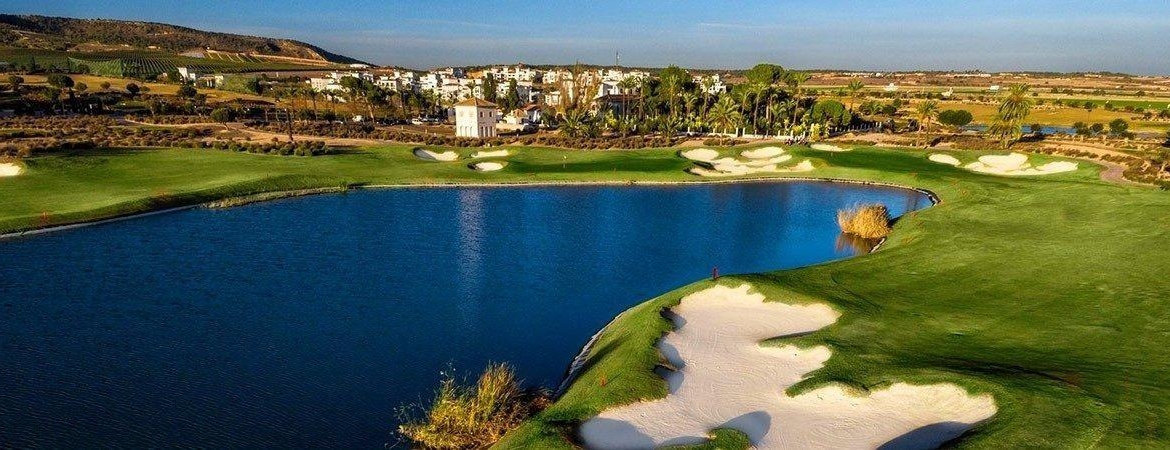 Aerial view of the golf course lake, bunkers and clubhouse at Condado de Alhama Golf Resort, Murcia