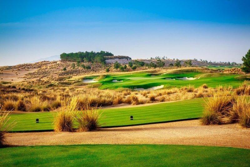 Sunlit golf fairway with tee markers at Condado de Alhama Golf Resort, Murcia