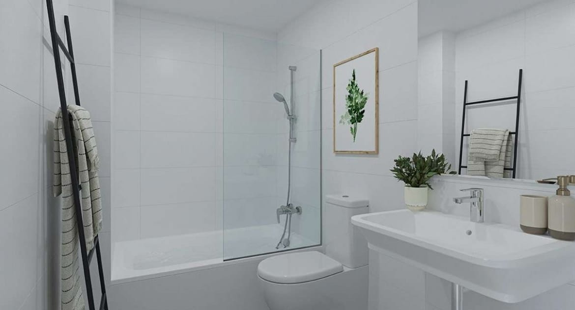 Rendering of a bathroom with bathtub, white washbasin and framed wall prints in Jávea, Alicante