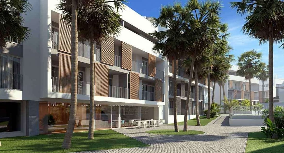 Rendering of the apartment buildings, palm-lined paths and communal gardens in Jávea, Alicante