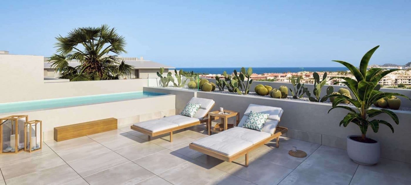 Rendering of a rooftop terrace with loungers and distant coastal surroundings in Jávea, Alicante