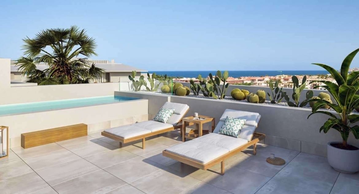 Rendering of a rooftop terrace with loungers and distant coastal surroundings in Jávea, Alicante