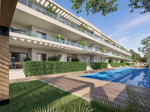 Communal pool beside terraces, planted hedges and a lawn in Los Narejos, Murcia