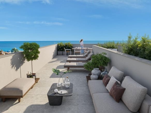 Rooftop solarium with a sofa, sun loungers, dining furniture and sea views in Los Narejos, Murcia