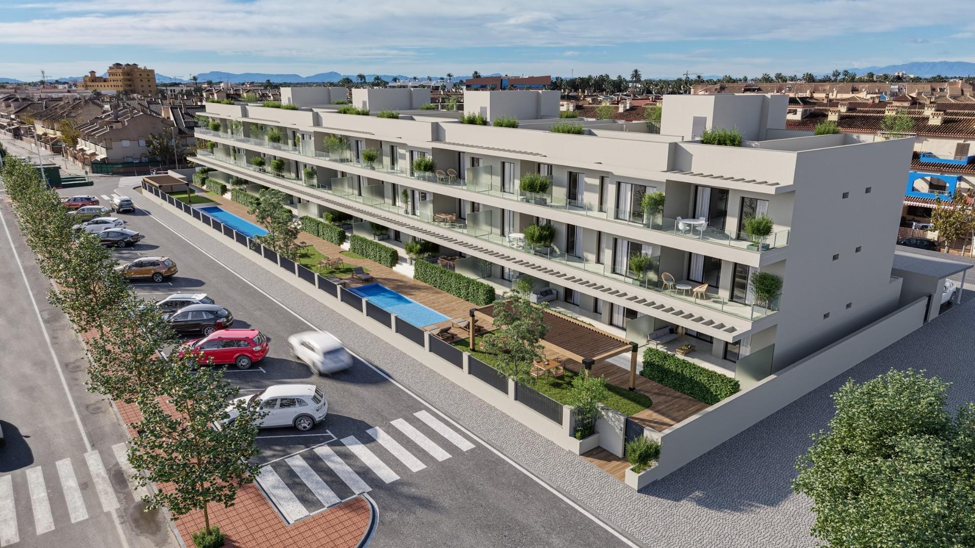 New-Build-Apartments-250-m-from-Los-Narejos-Beach-in-Los-Alcazares-3 Aerial view of the residential facade, communal pools and street parking in Los Narejos, Murcia