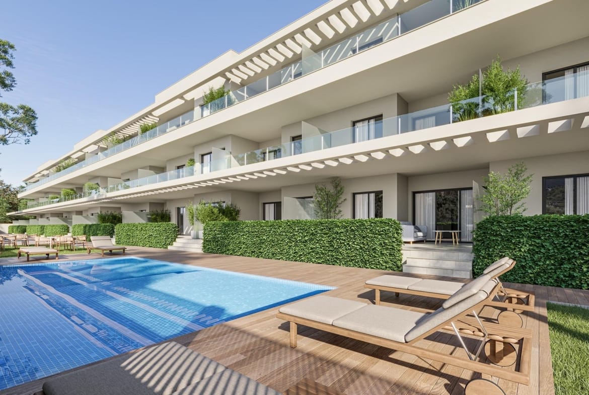 Apartment facade with broad terraces overlooking a communal swimming pool and sun deck in Los Narejos, Murcia