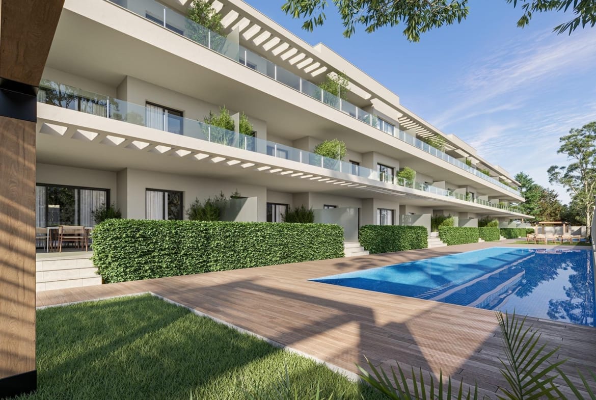 Communal pool beside terraces, planted hedges and a lawn in Los Narejos, Murcia