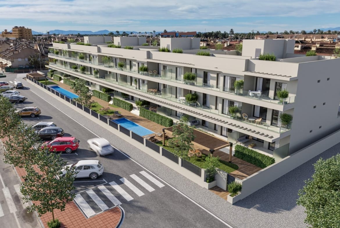 Aerial view of the residential facade, communal pools and street parking in Los Narejos, Murcia