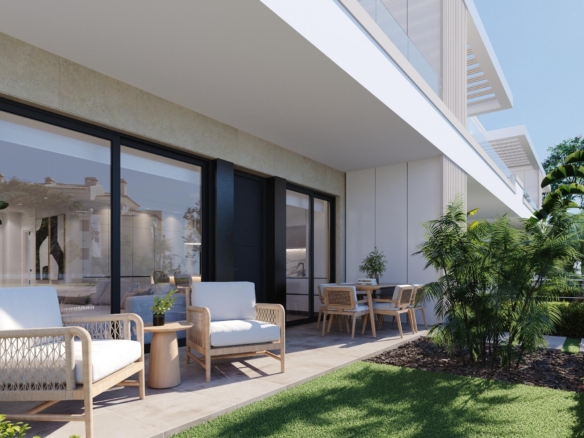 Ground-floor terrace with cushioned wicker seats, dining table and sliding glass doors to interior