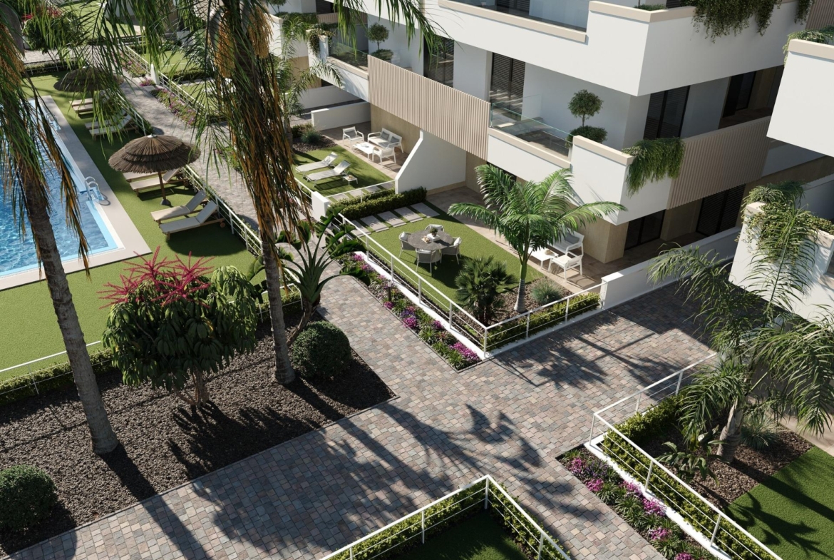 Ground-floor terraces with garden seating, palm trees and paved pedestrian paths
