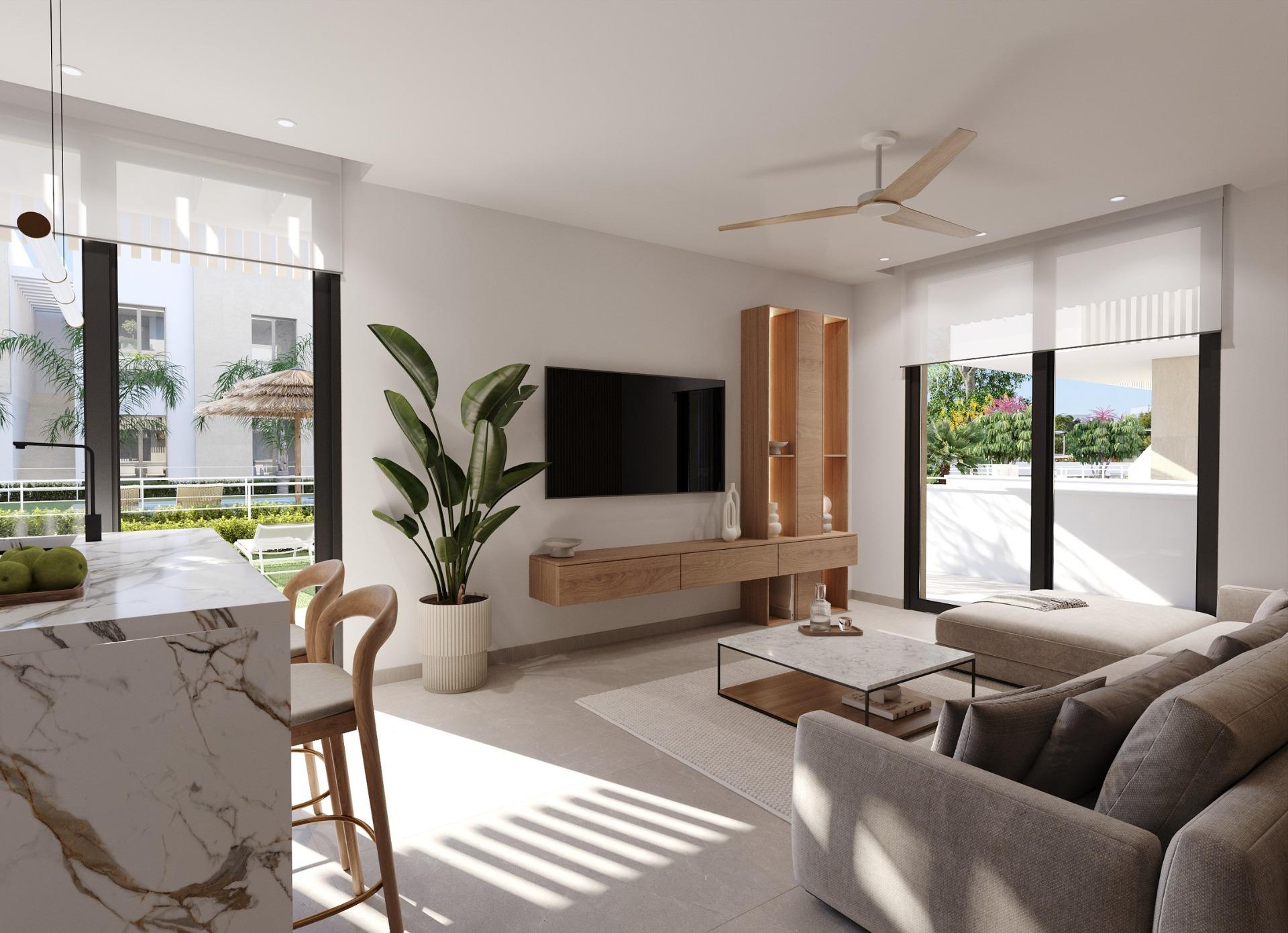 New-Build-Apartments-and-Bungalows-in-Santa-Rosalia-Lake-and-Life-Resort-5 Open-plan living room with TV wall, kitchen island and terrace doors