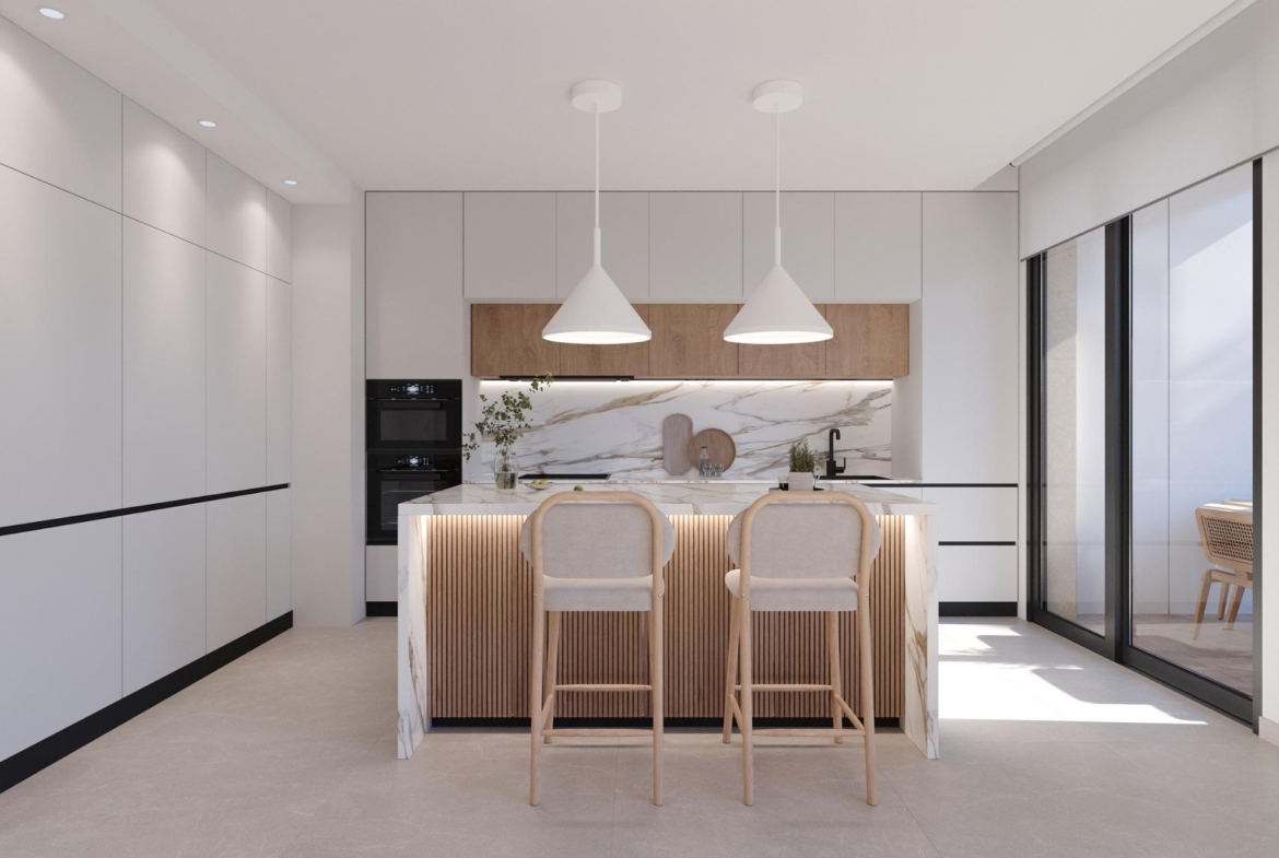 Kitchen view featuring a marble-front island, two bar stools and tall fitted cupboards