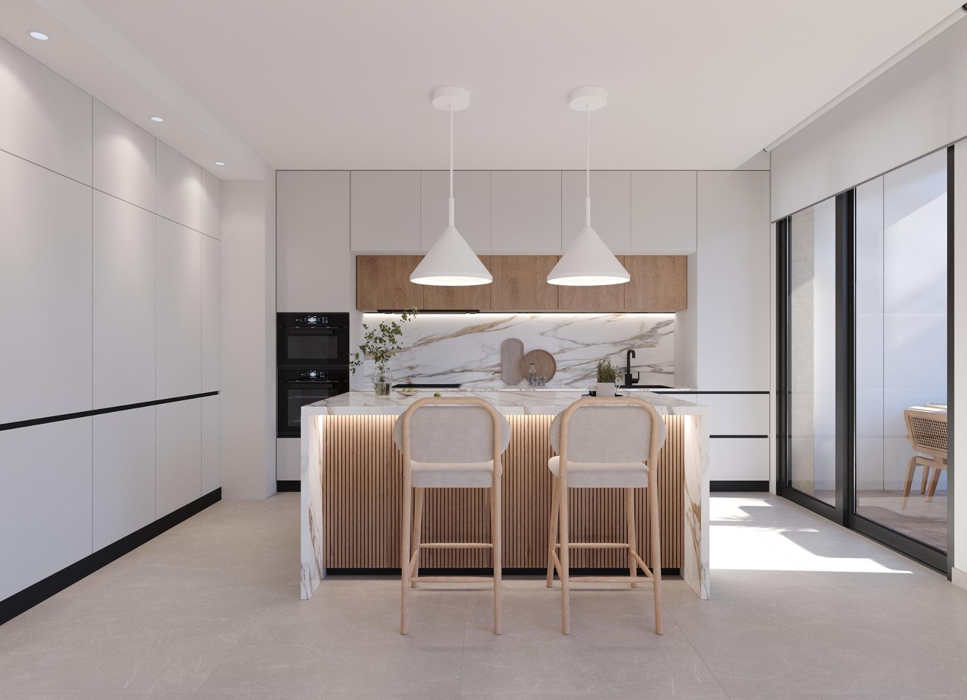 Kitchen view featuring a marble-front island, two bar stools and tall fitted cupboards