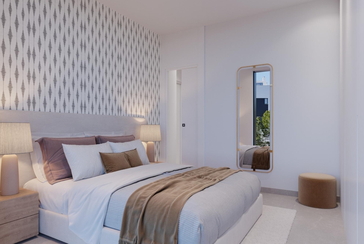 Double bedroom with patterned accent wall, bedside lamps and full-length mirror