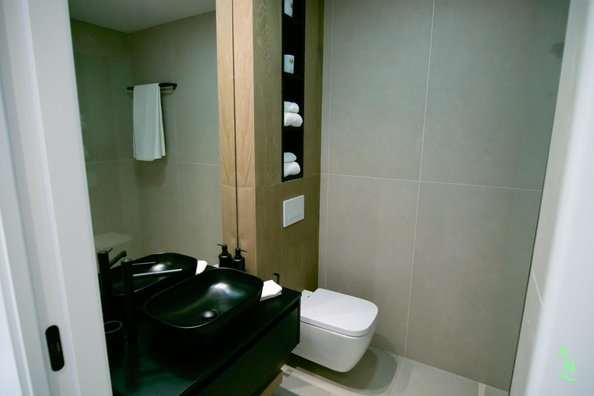 Modern bathroom with black basin and walk-in shower