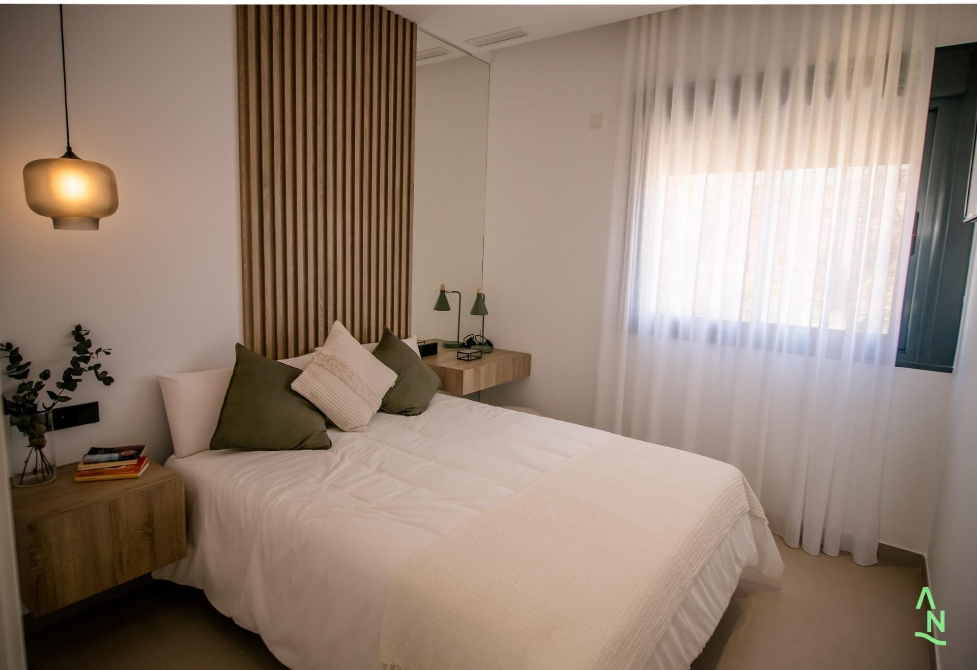 New-Build-Apartments-at-Condado-de-Alhama-Golf-Resort-Murcia-12 Bedroom with large window and soft neutral decor