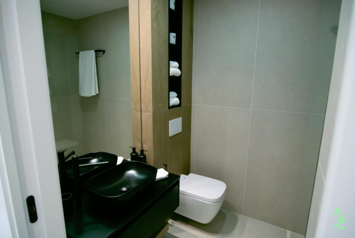 Contemporary bathroom with black basin and walk-in shower