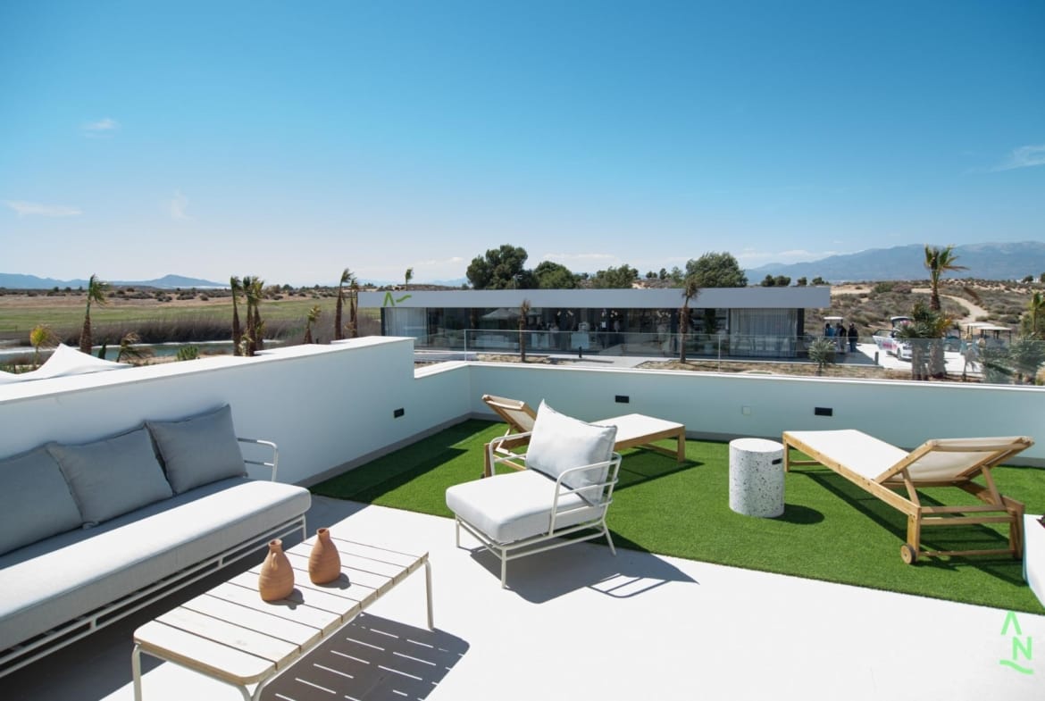 Private rooftop solarium with seating and loungers at Condado de Alhama