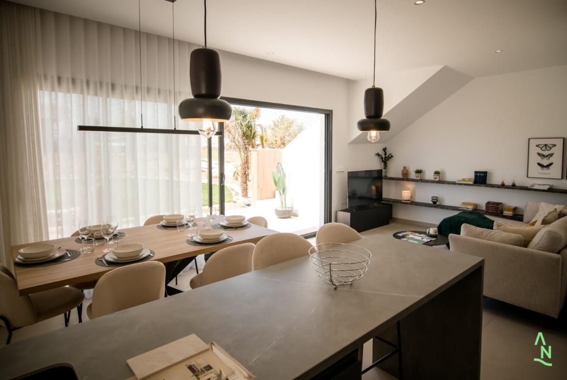 Open-plan living area with dining space and large sliding doors