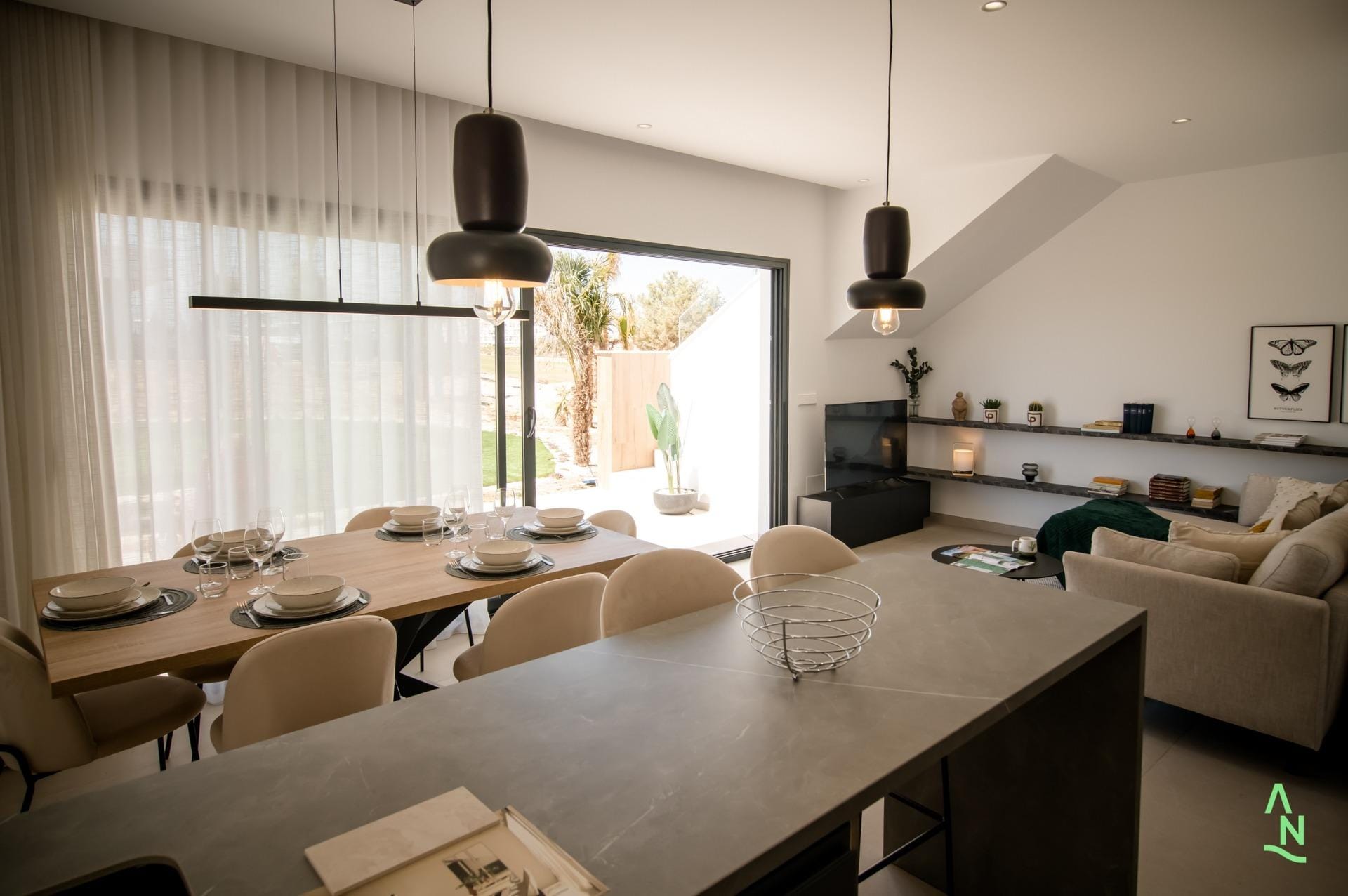 Open-plan living area with dining space and large sliding doors