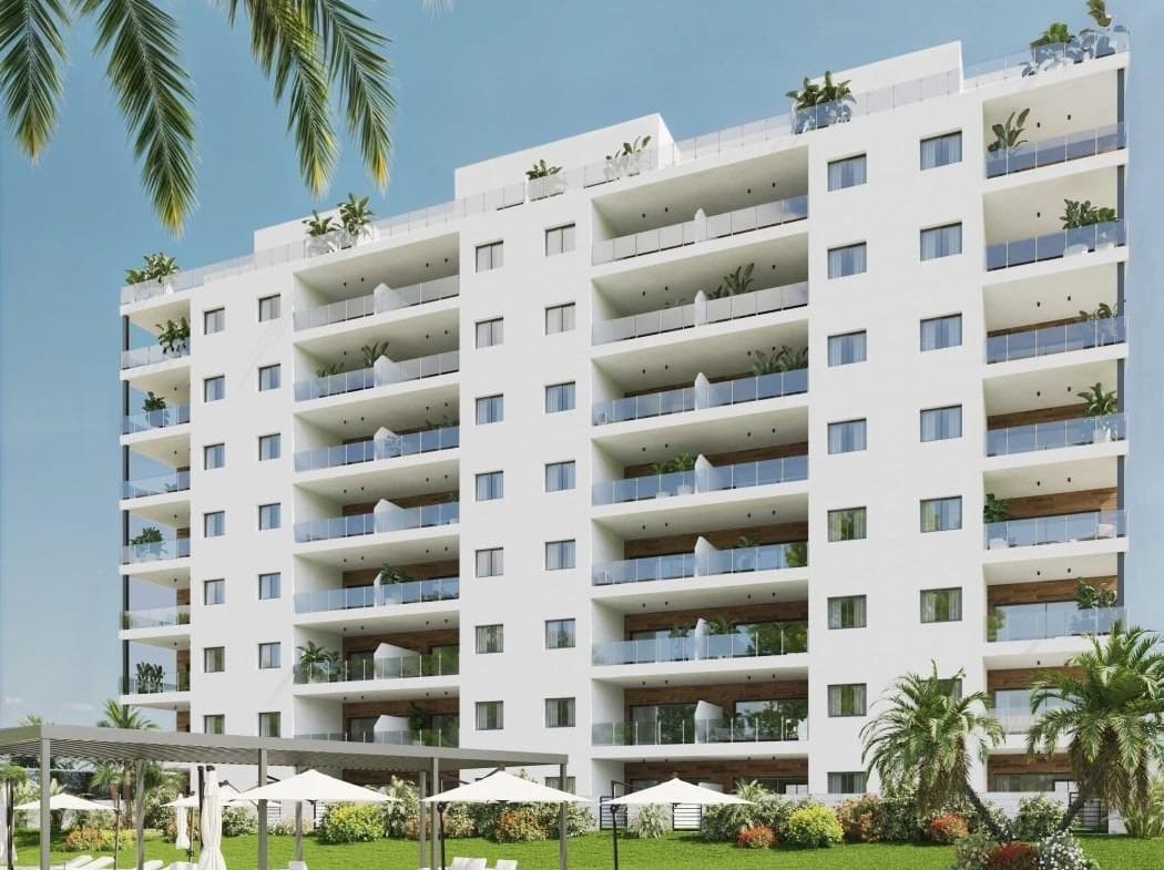 Modern apartment building with communal pool and landscaped gardens