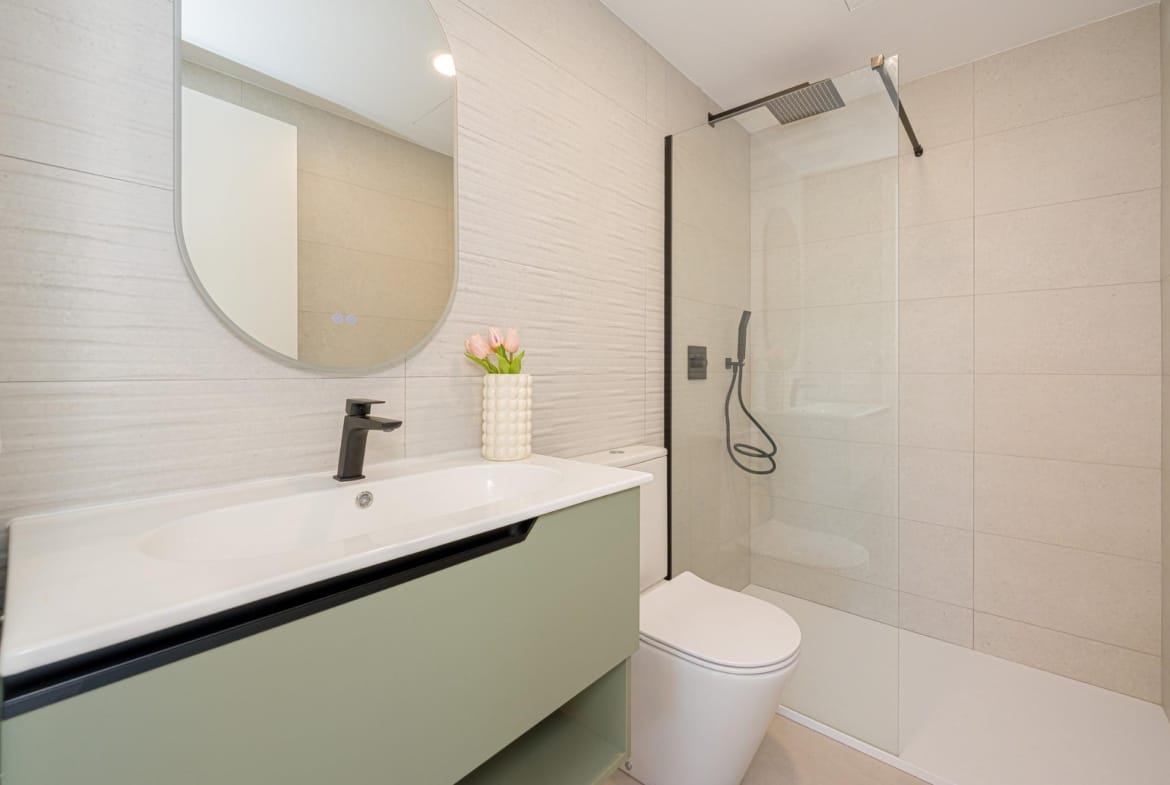 Modern bathroom with walk-in shower and vanity unit