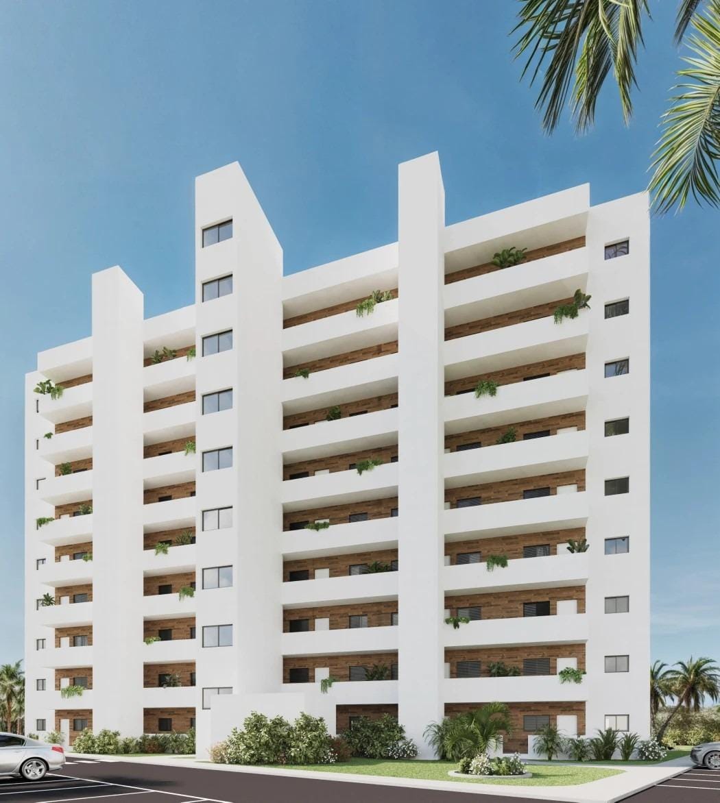 Rear view of the apartment building with balconies and parking area