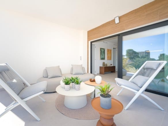 Covered terrace with lounge seating opening into the living area