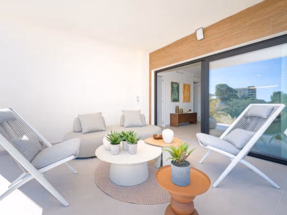Covered terrace with lounge seating opening into the living area