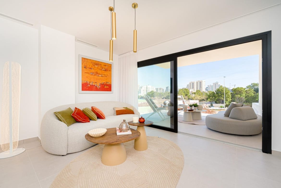Bright living room with large sliding doors opening to the terrace