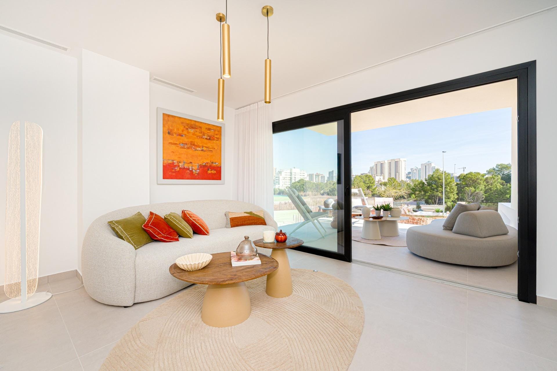 Bright living room with large sliding doors opening to the terrace